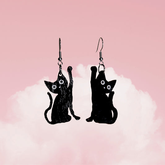 Kissat, korvakoru koukulla